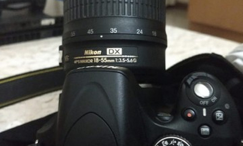 Nikon D5100 + Lente ...